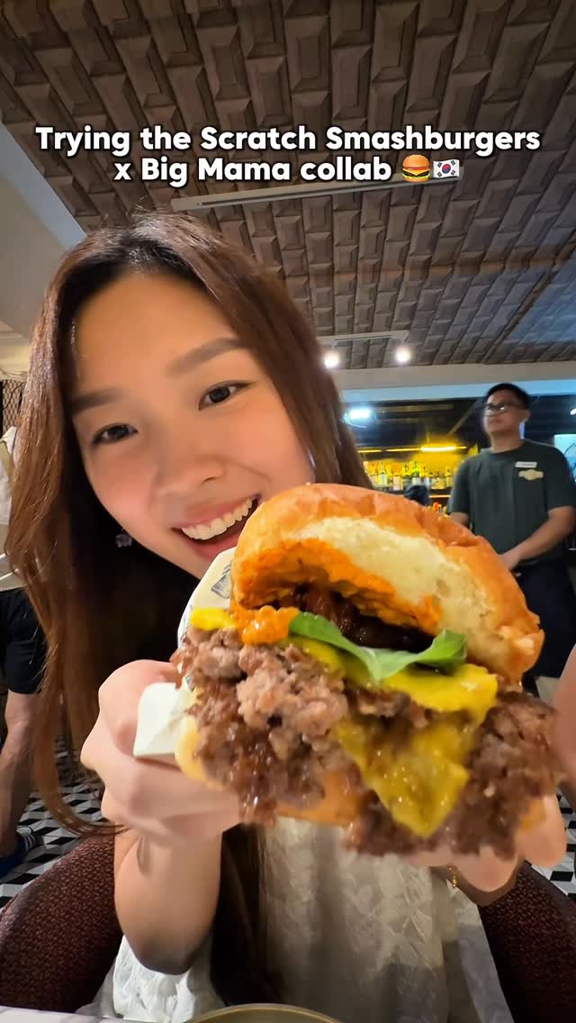 Customer holding a Scratch Smashburger